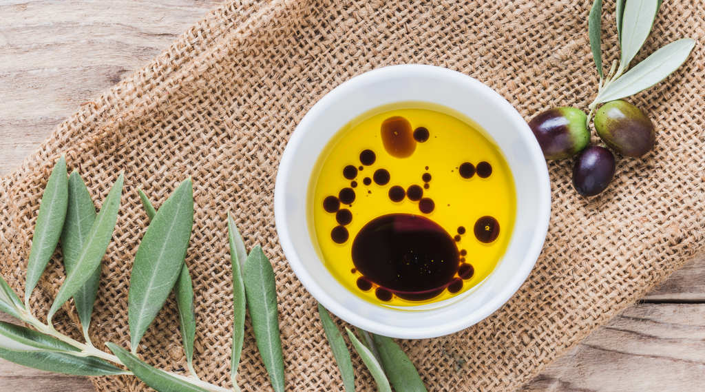 Olive oil and vinegar in a white bowl 