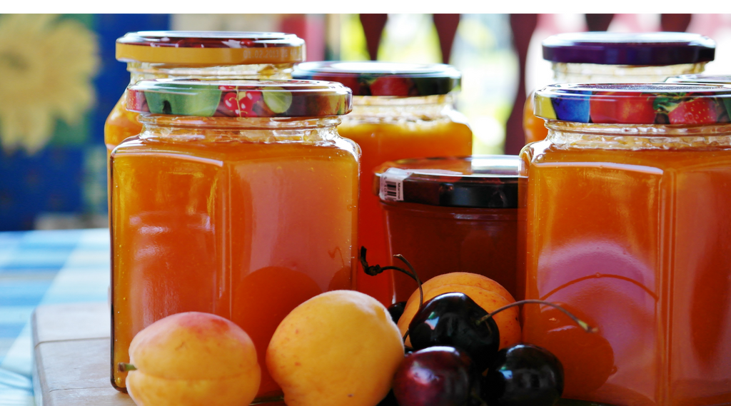 Glass jars of preserves and honey